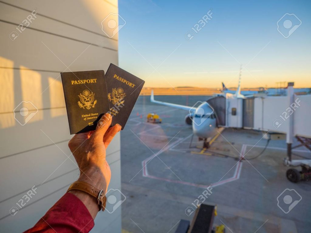 Traveler holding passport at airport immigration for Tanzania entry requirements