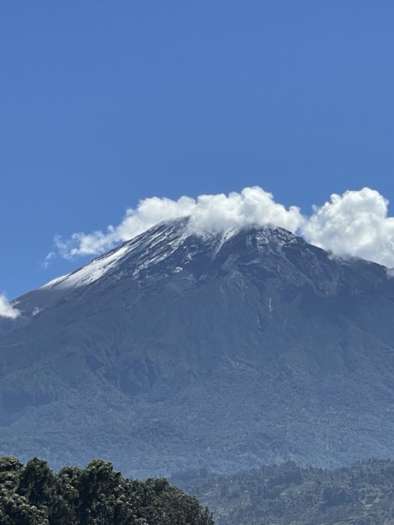 Mount Meru mountain in Tanzania with lush forest and scenic landscape in Arusha National Park