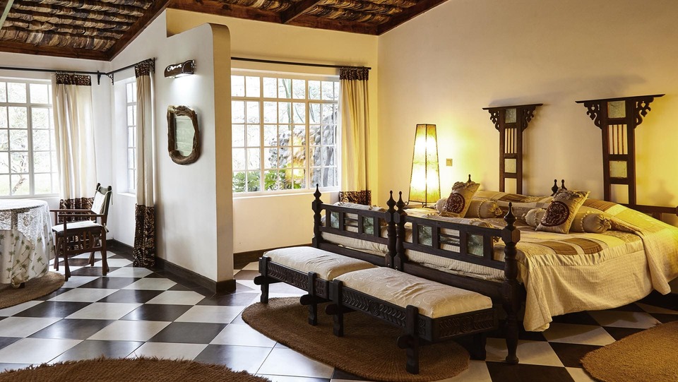 Hatari Lodge room interior comfortable safari accommodation Arusha Tanzania